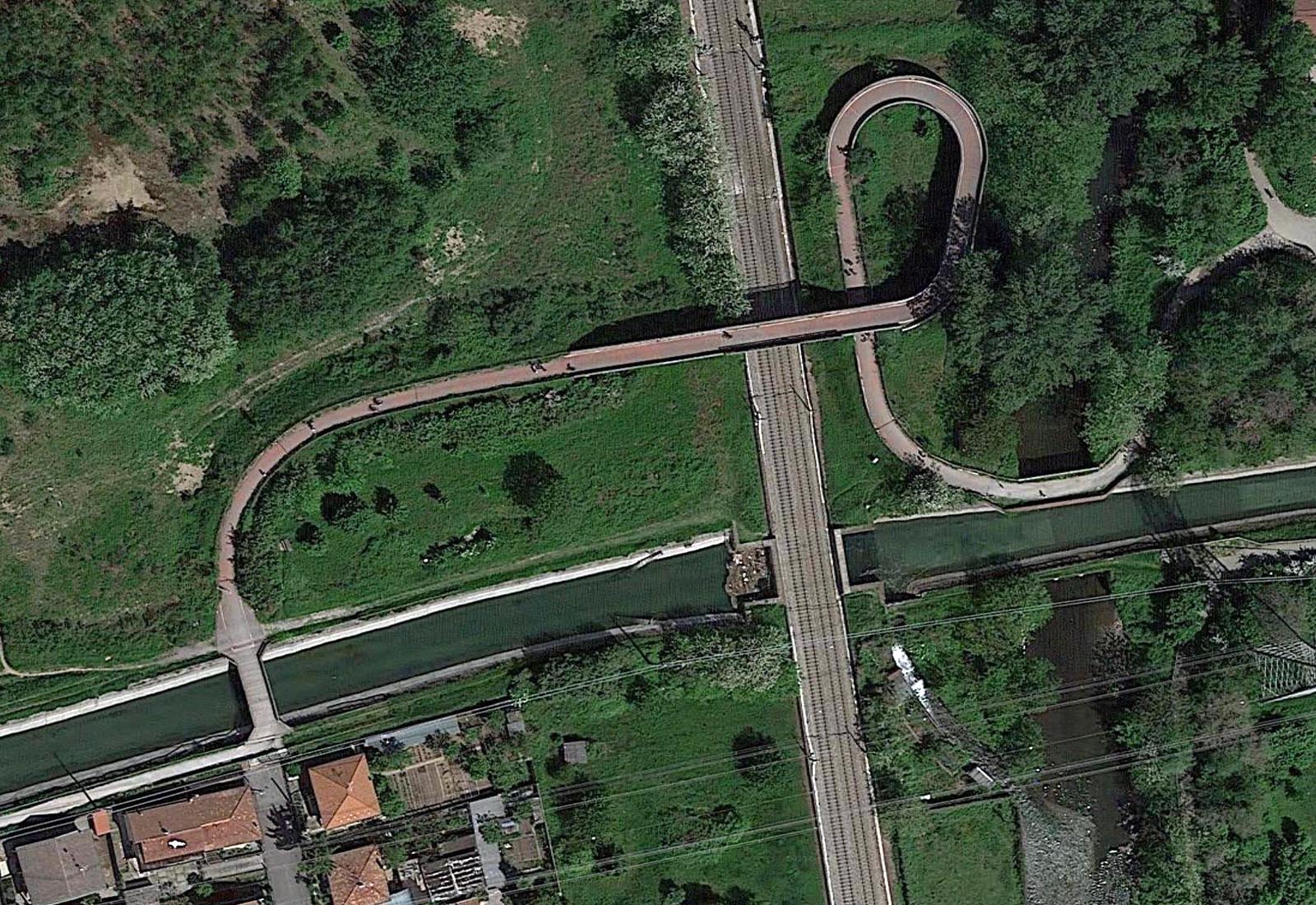 Railroad overpass and bridge over Villoresi canal in Paderno Dugnano - Zenithal aerial view